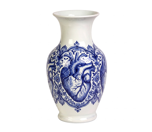 Blue and white ceramic vase featuring an anatomical heart surrounded by ornate floral patterns.
